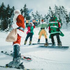 Santa Claus riding snowboard