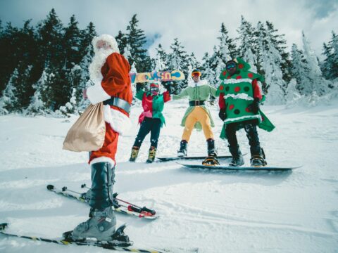 Santa Claus riding snowboard